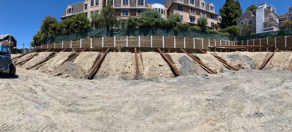 Raker-supported wall during excavation