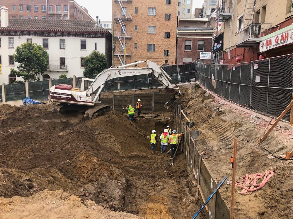 Soldier pile retaining wall
